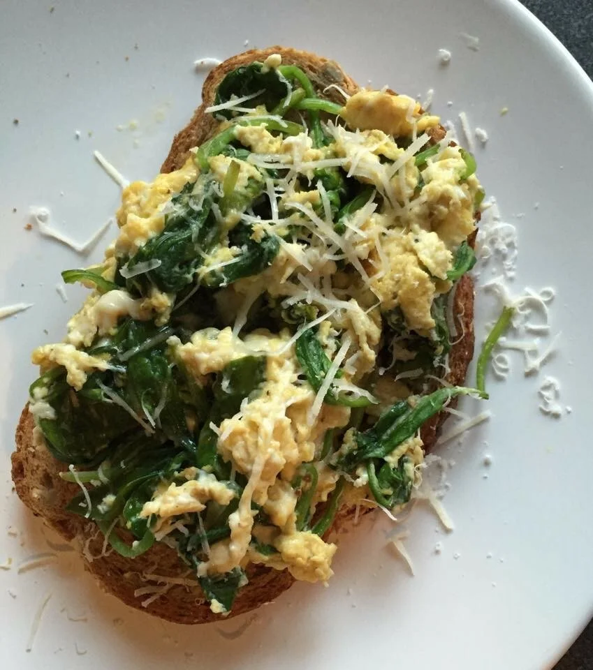 Toast with spinach, eggs, and parmesan