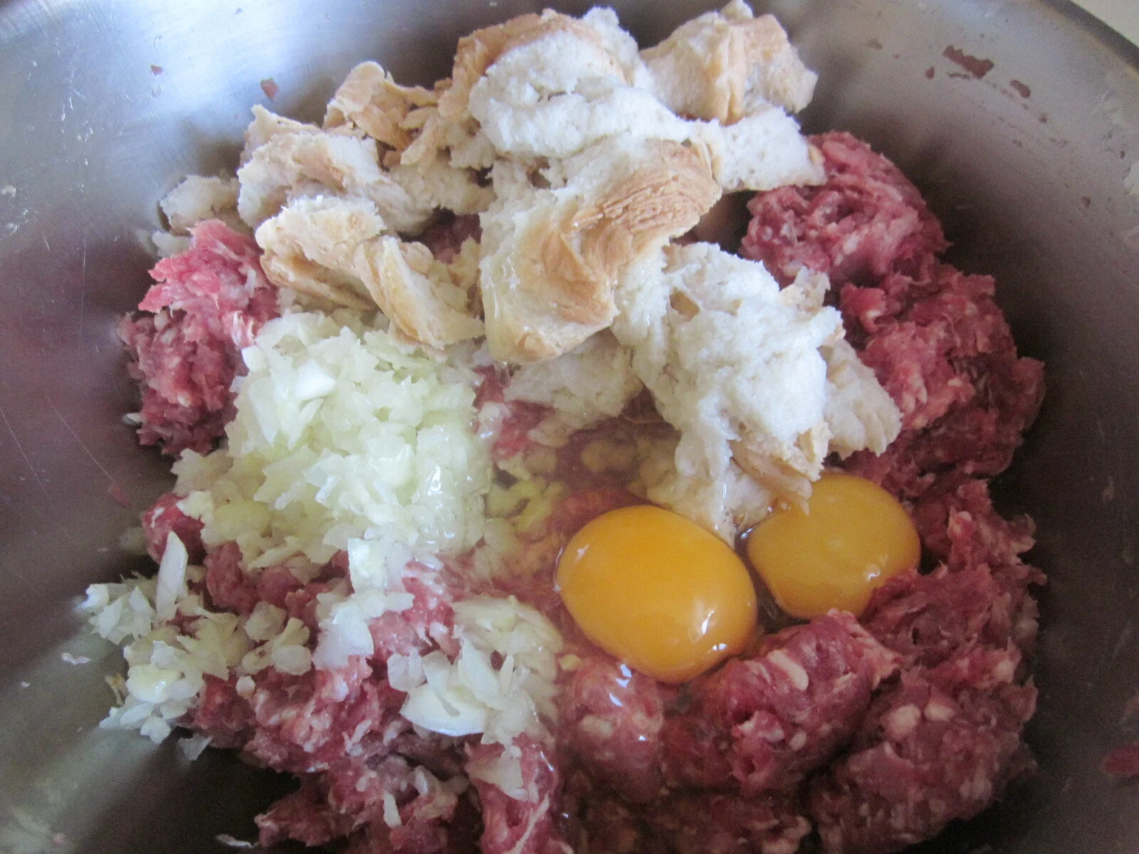 Minced meat roll stuffed with corn, bell peppers, and cheese