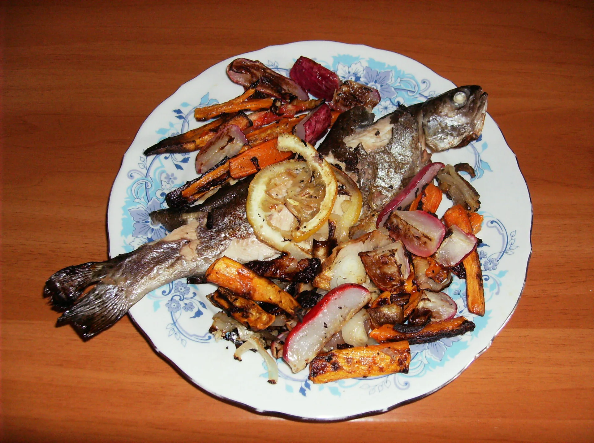 Oven-baked trout with roasted radishes and vegetables