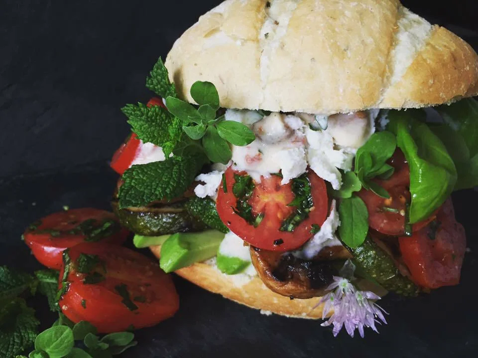 Grilled vegetable sandwich with spicy Tzatziki sauce, sun-dried tomatoes, and Feta cheese