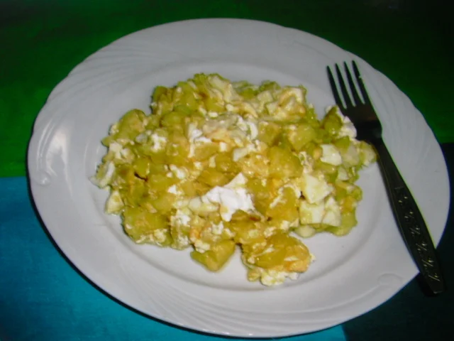 Potato salad with egg, sour cream, and cheese