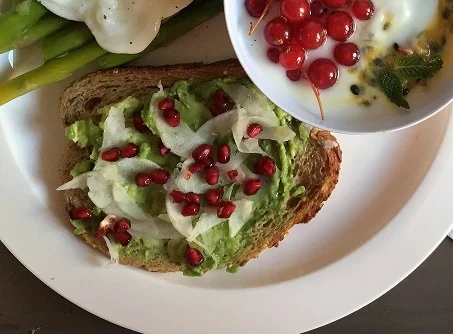 Toast with avocado, fennel, and pomegranate seeds