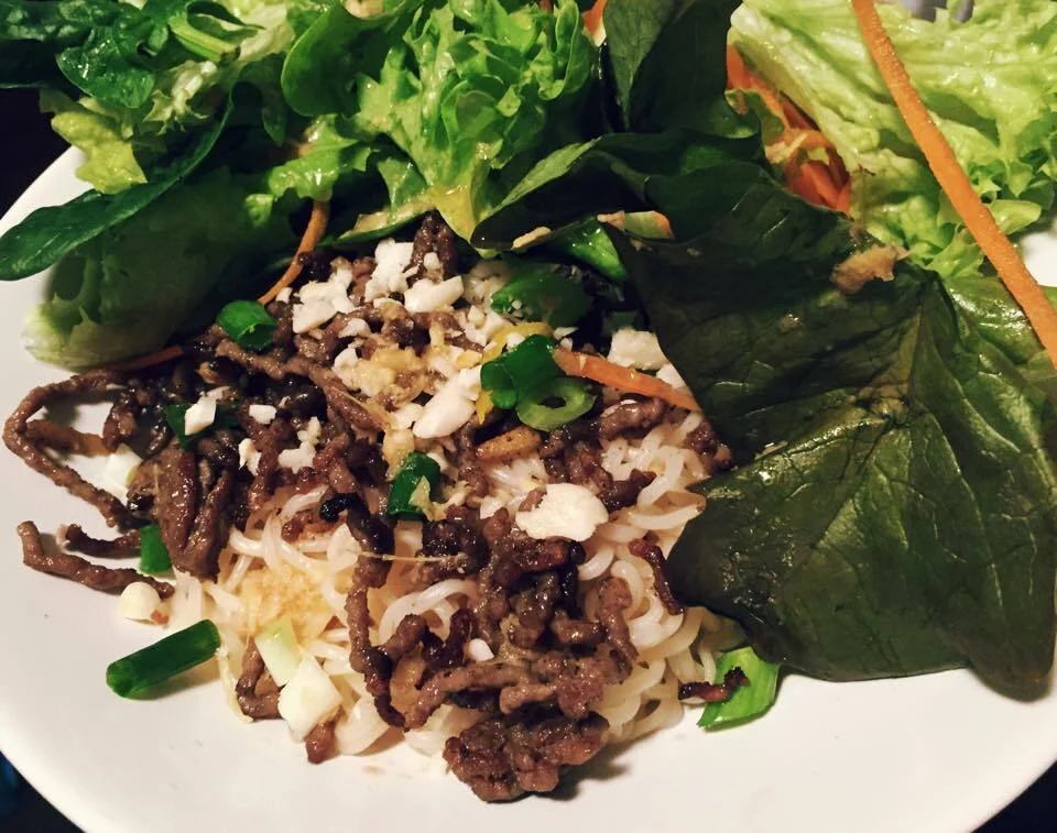 Crispy beef with noodles and Asian-style salad