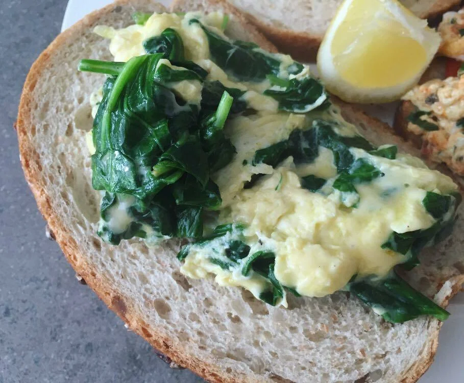 Toast with creamy eggs and spinach