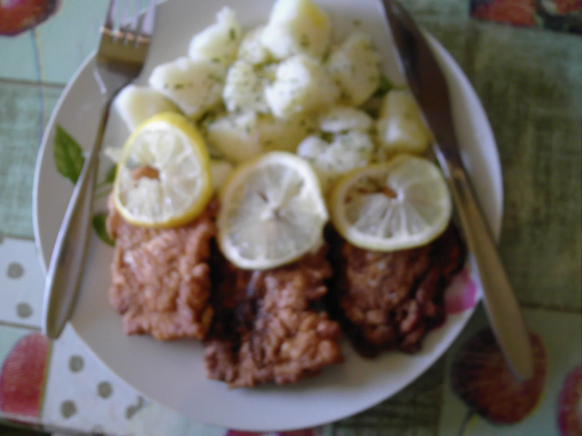 Breaded Pangasius with a side of natural potatoes