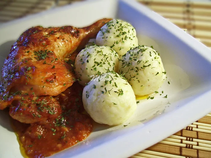 Chicken with tomato sauce and potato dumplings