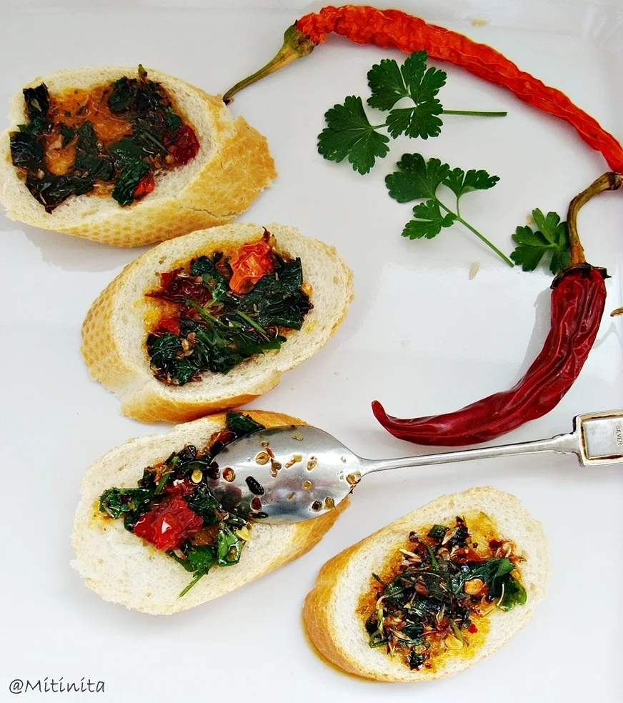 Bruschetta spread with sun-dried tomatoes, hot peppers, and fresh herbs