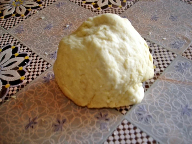 White and black pancakes in the pan