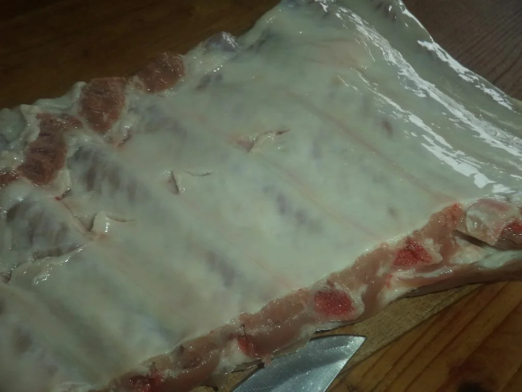 Ribs and sausages in tomato sauce with rice pilaf