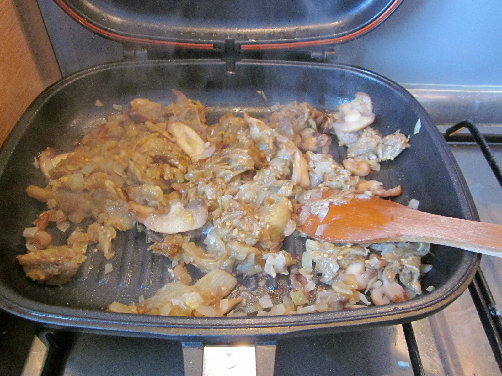 Moussaka with potatoes, mushrooms, eggplant, pork, and beef