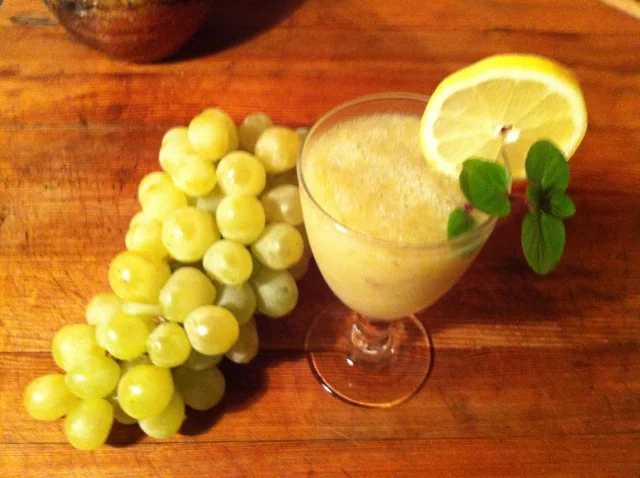 Grapes with lemon in a glass