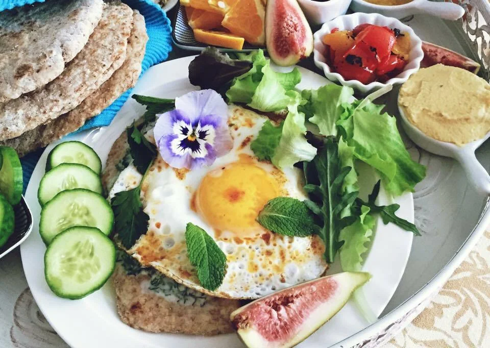 Turkish-style fried eggs with yogurt sauce and spicy butter