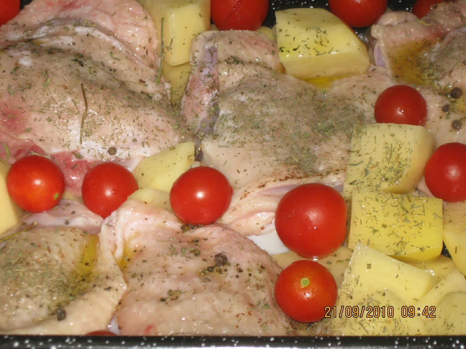 Marinated chicken thighs with roasted potatoes and cherry tomatoes