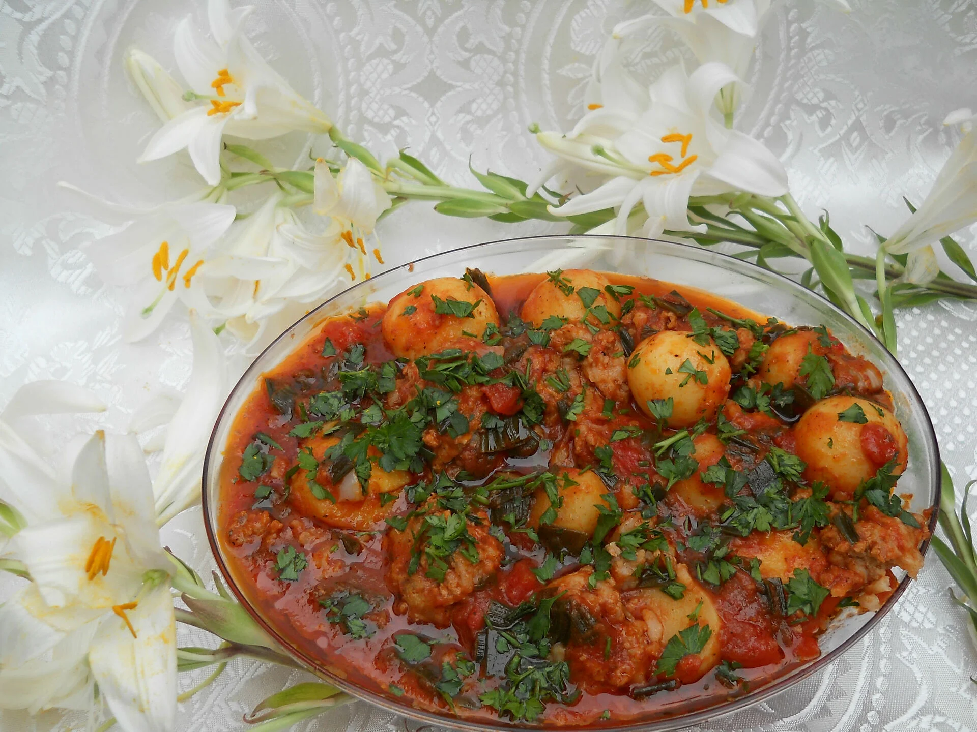 Meatballs and new potatoes in tomato sauce