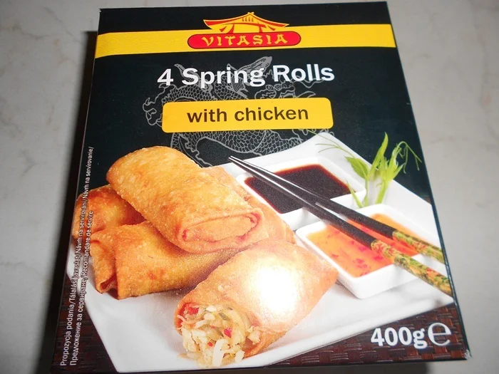 Asian packages with vegetables and pink sauce