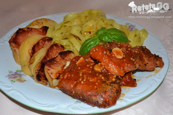 Pork steak with sweet and sour sauce, quince, and tagliatelle