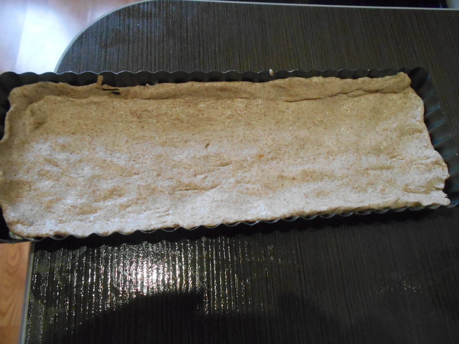 Pizza with zucchini, cheese, and ham