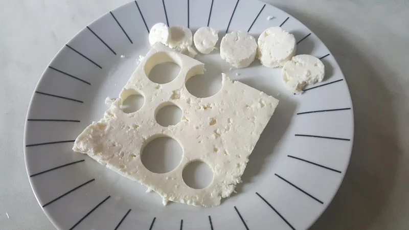 Scrambled eggs with telemea cheese and green onion leaves