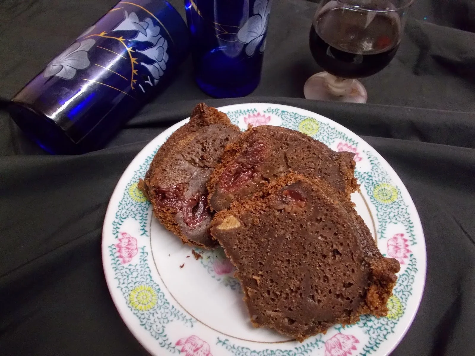 Cake with wine, chocolate, and cherries