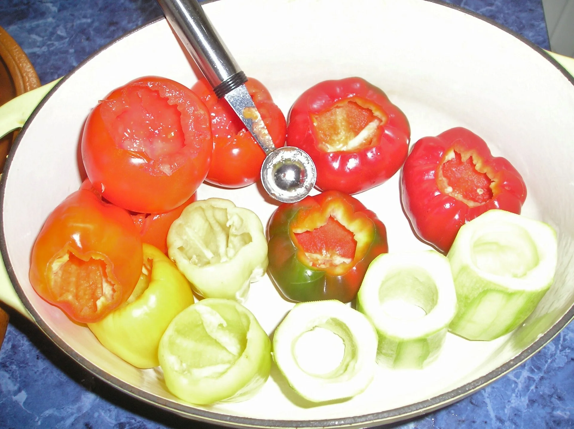 Zucchini, peppers, stuffed tomatoes in a Roman pot