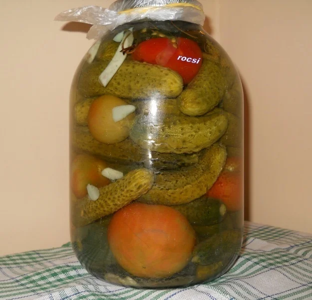 Pickled cucumbers with green tomatoes for winter