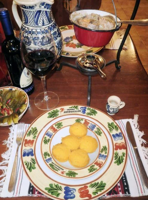 Transylvanian rabbit stew served in a cauldron with polenta