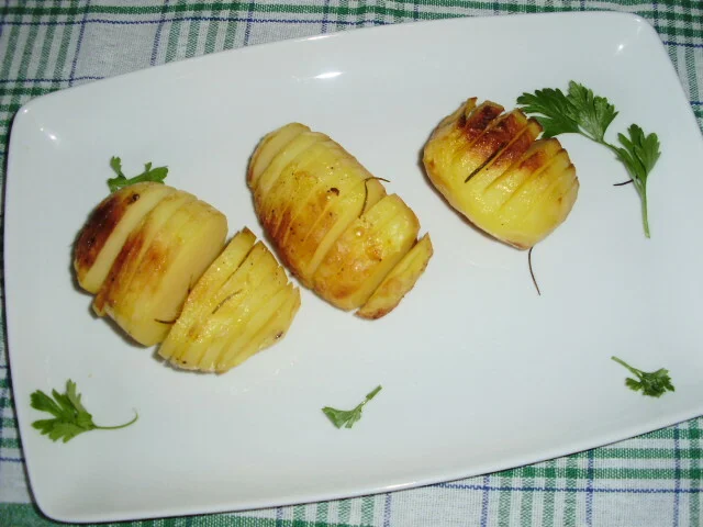 Accordion potatoes with butter and rosemary