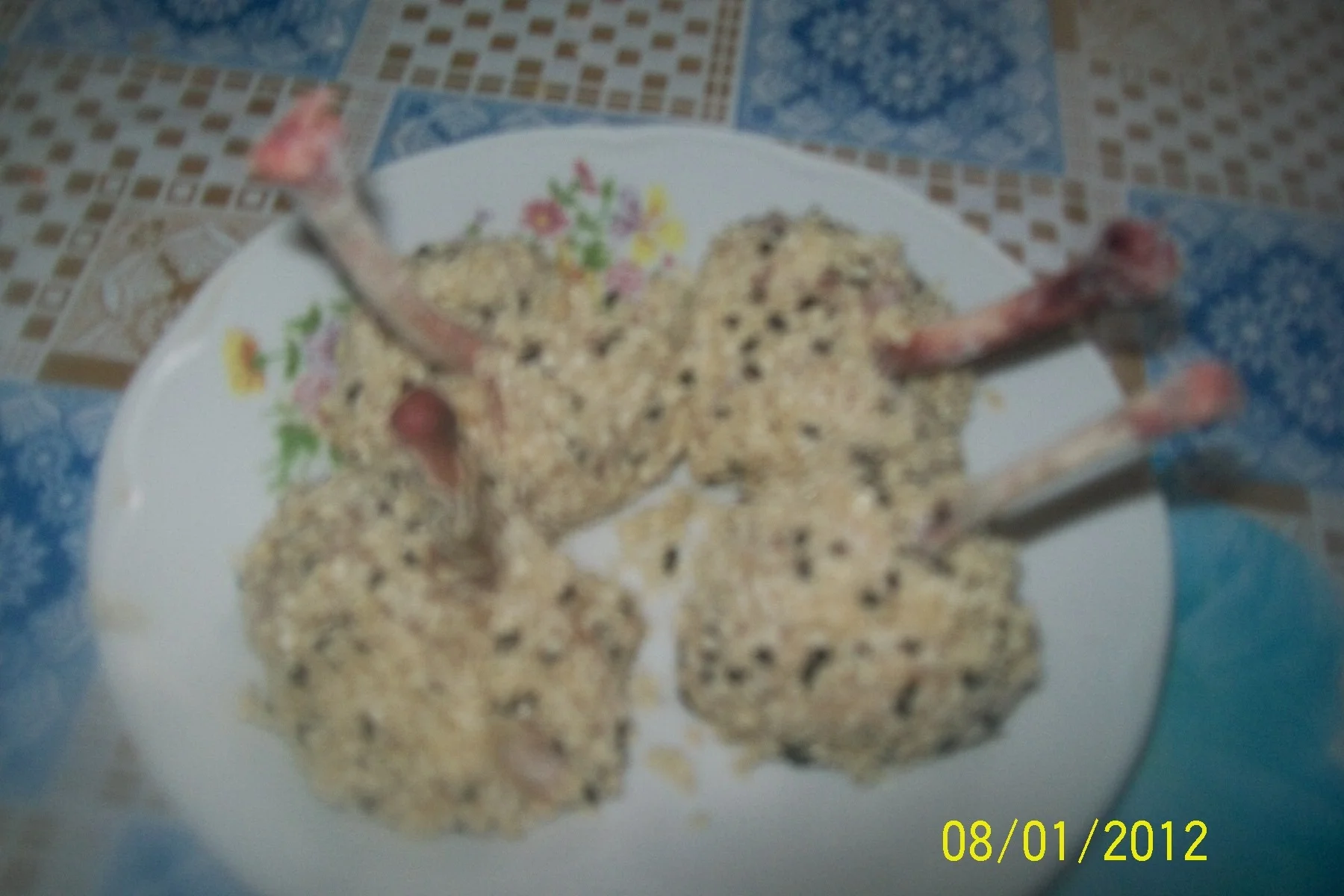 Lolly Pops made from spicy chicken wings with sesame and beetroot jelly