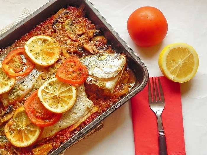 Oven-baked sea bream with tomatoes and lemon