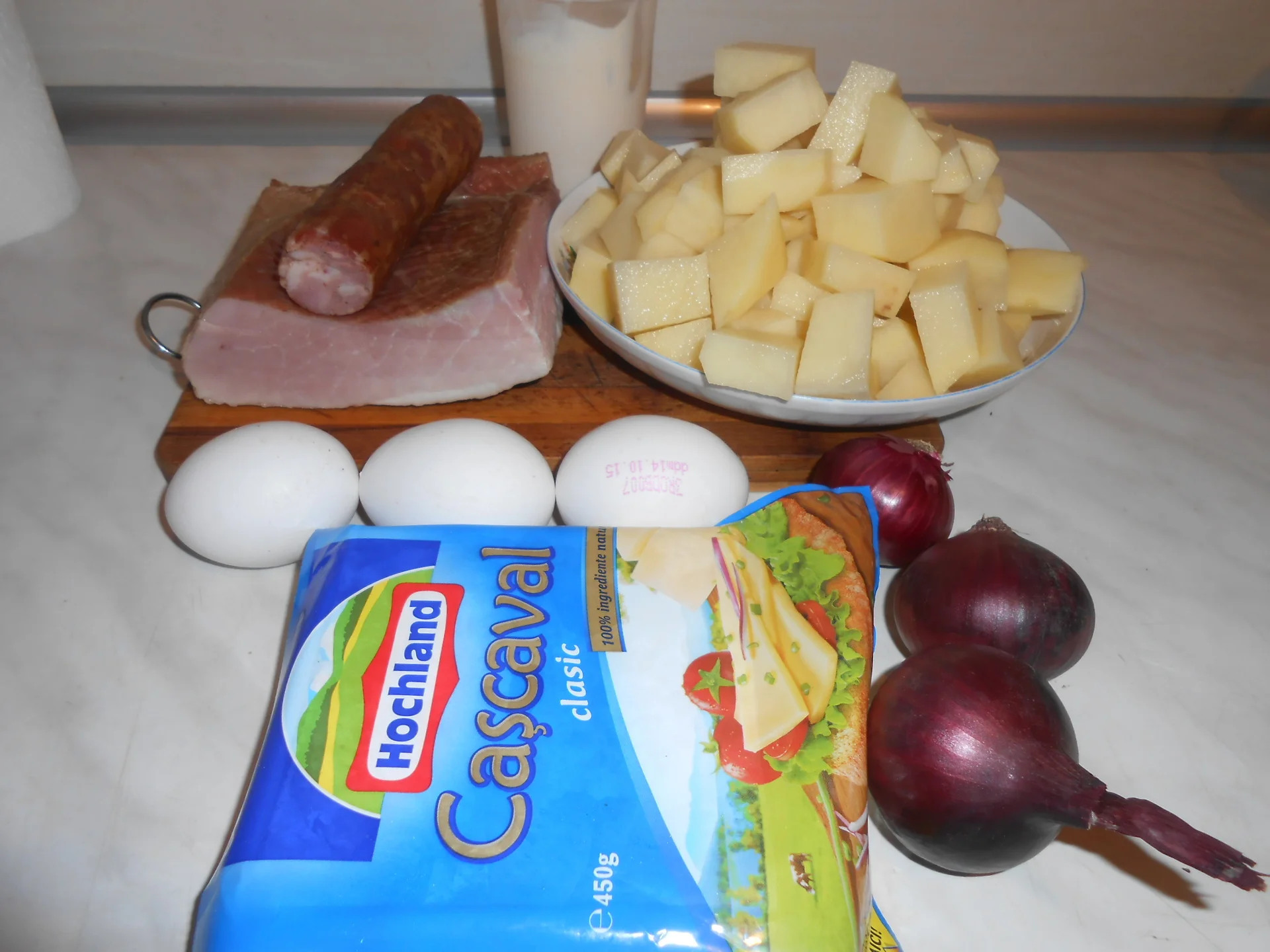 Potato pudding with pork pastrama