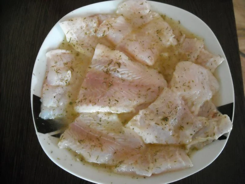 Grilled fish fillet with rice and supreme sauce