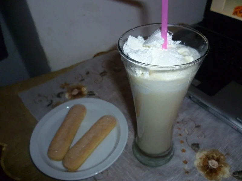 Hot banana milkshake with vanilla and whipped cream
