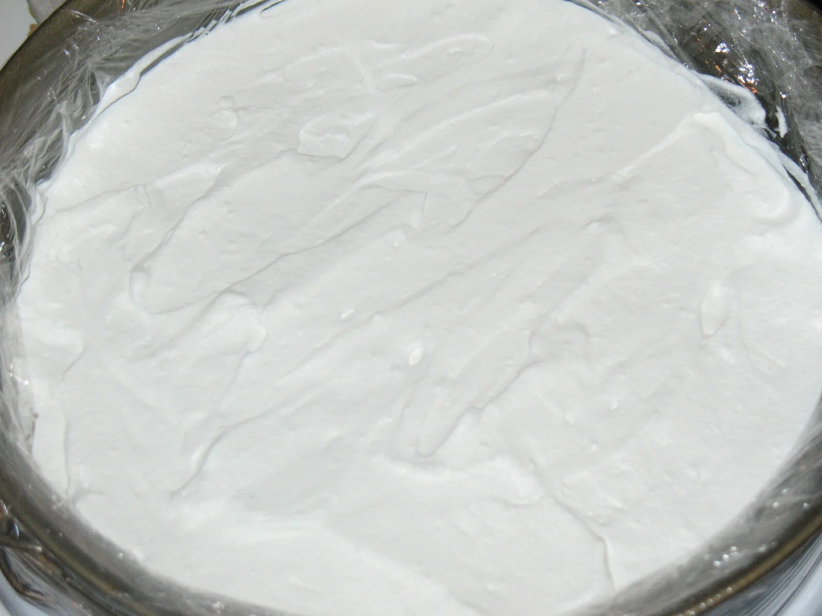 Raspberry cake with whipped cream and Hello Kitty chocolate