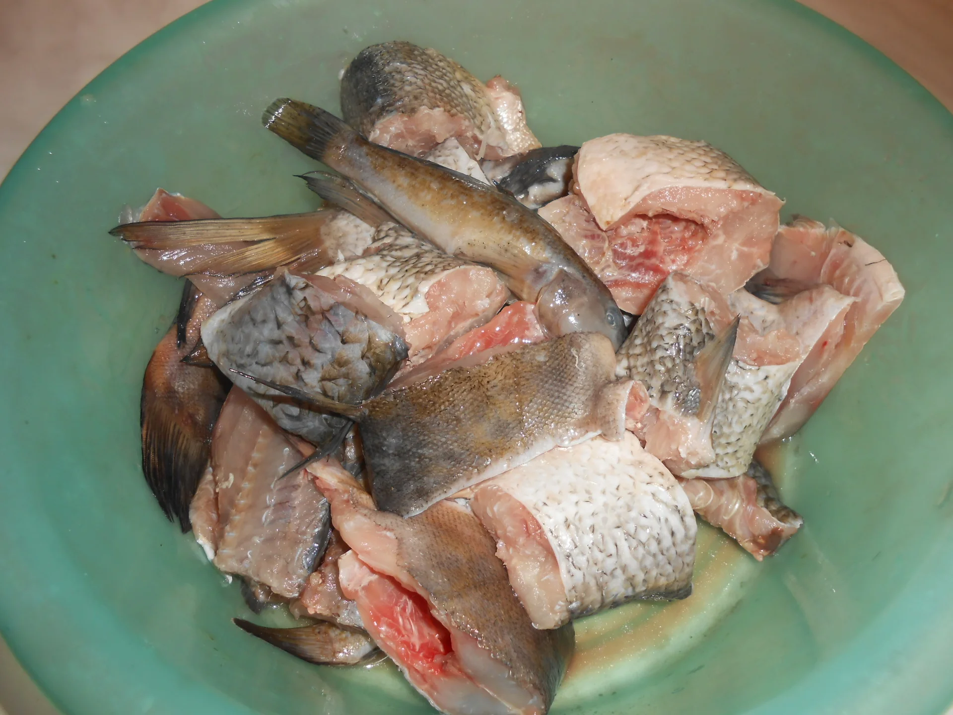 Mixed fried fish in a cauldron