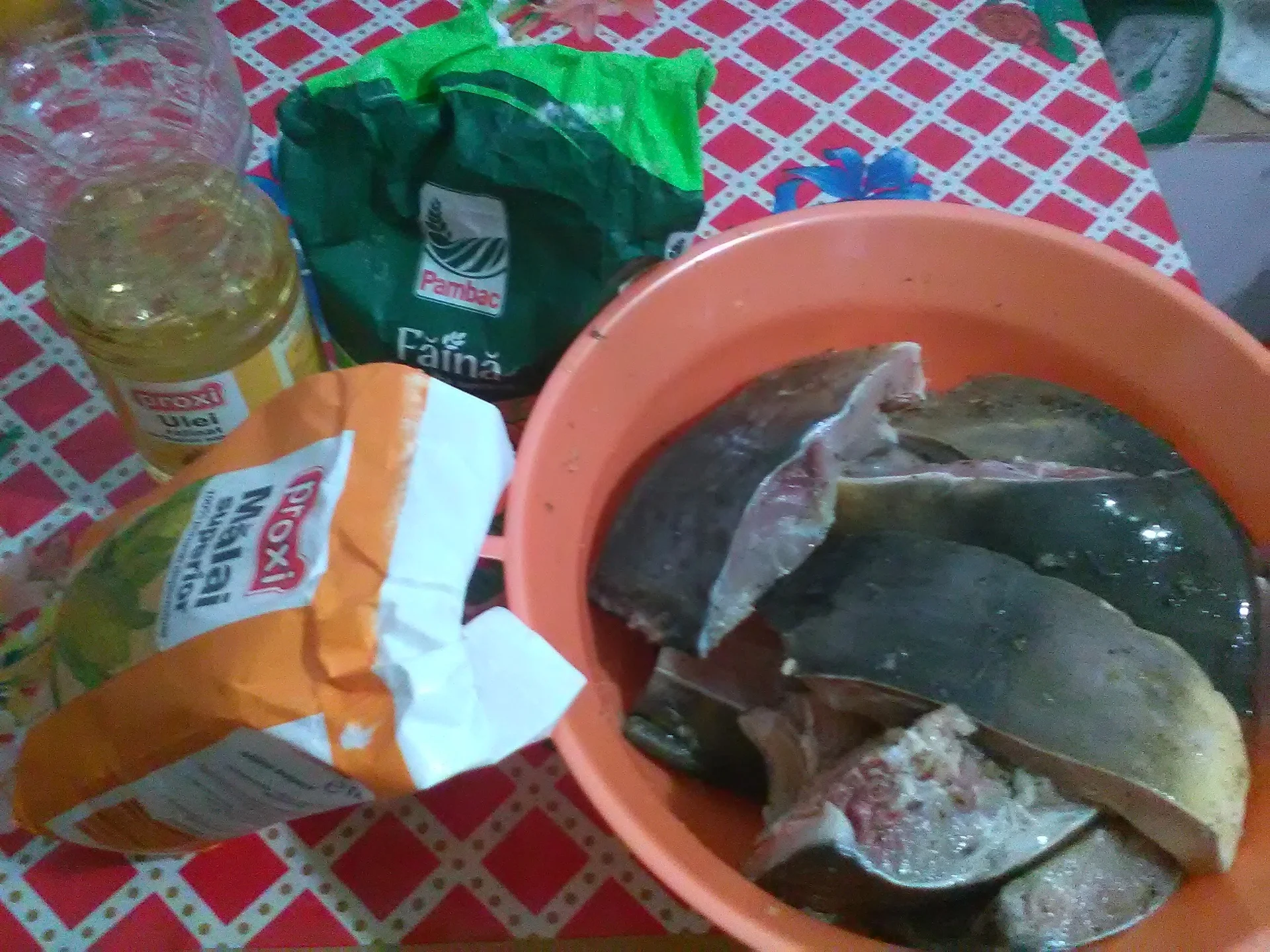 Fried carp with polenta and garlic sauce with tomatoes