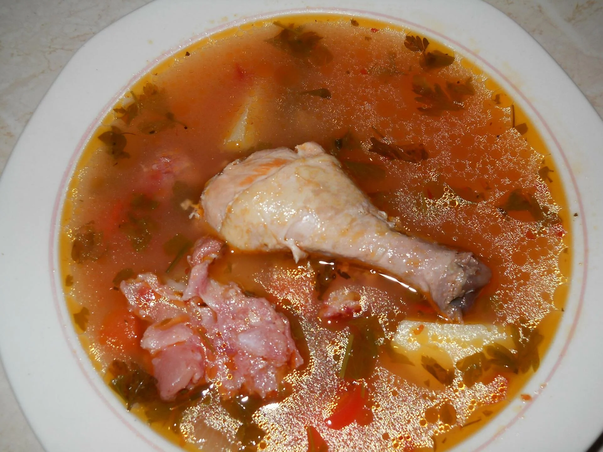Chicken leg and smoked meat soup