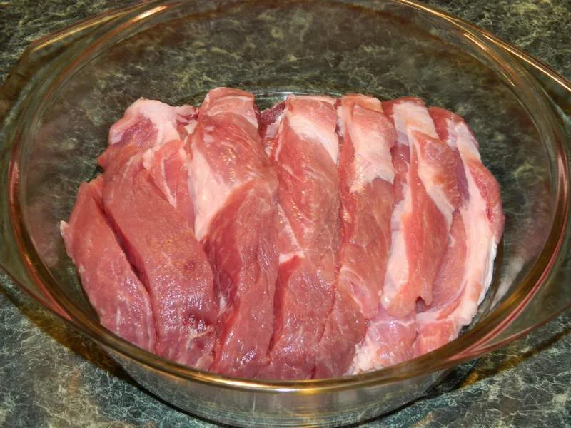 Oven-baked pork neck with bacon