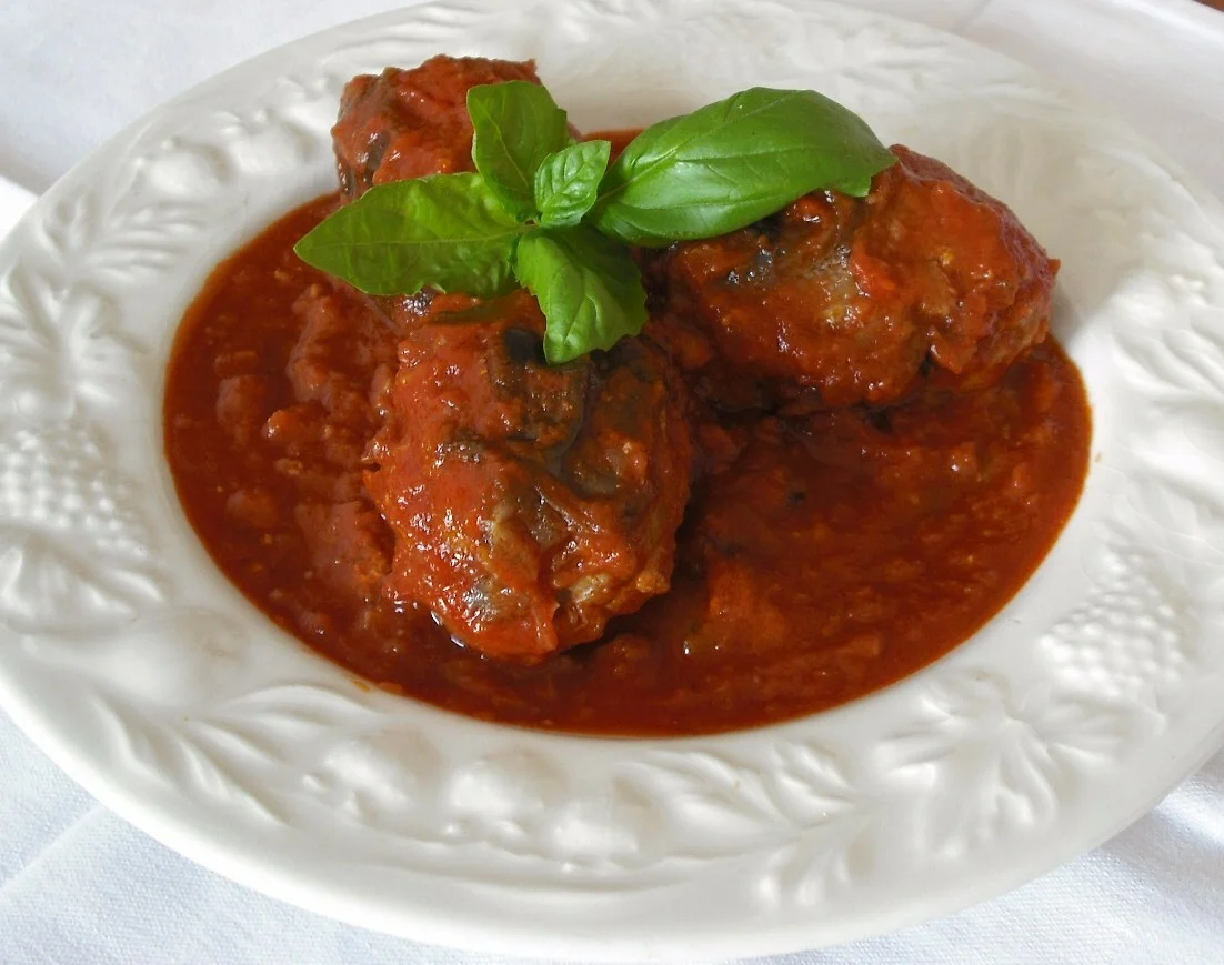 Mini eggplants stuffed in tomato sauce