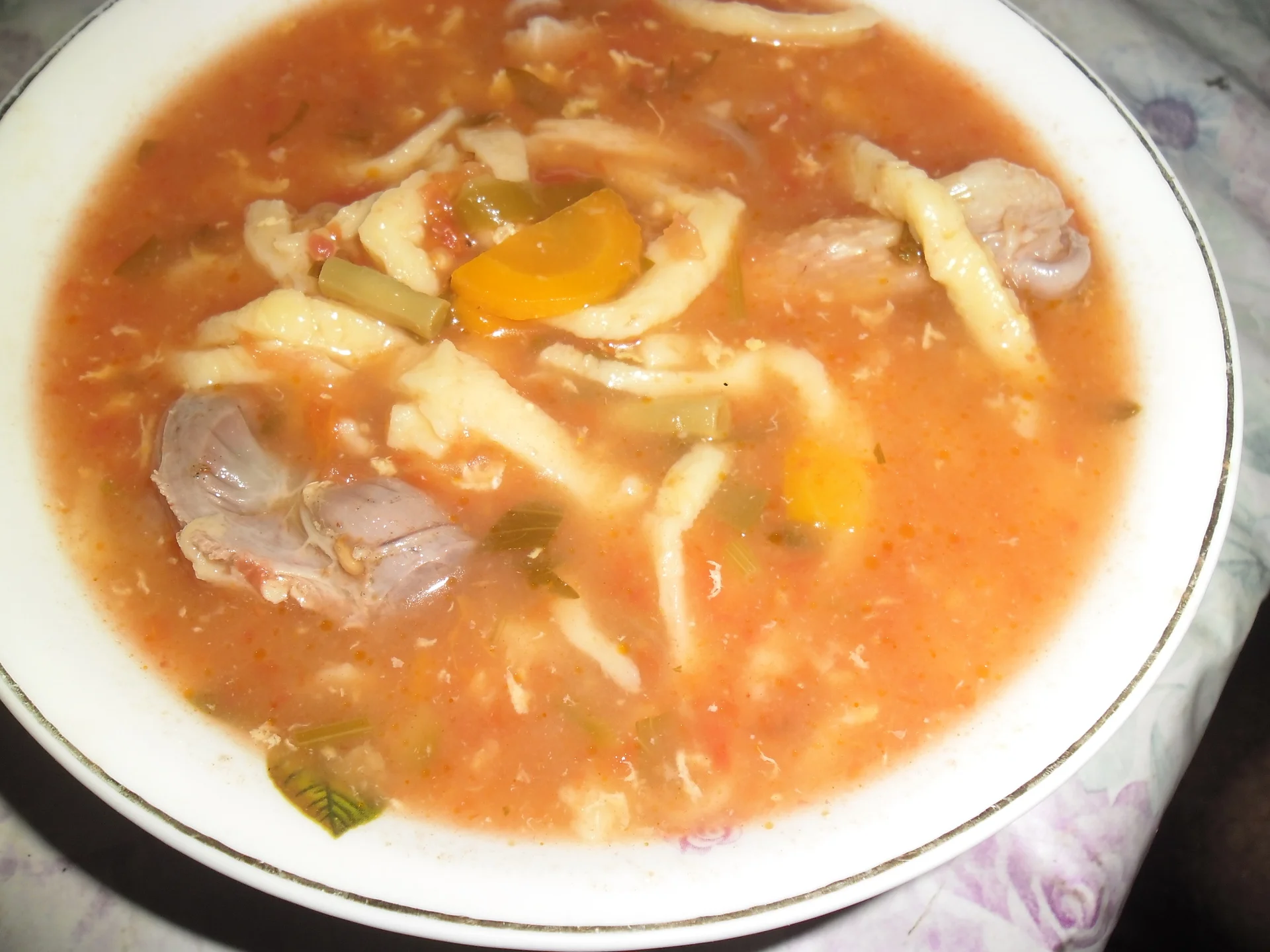 Tomato soup with chicken and homemade noodles