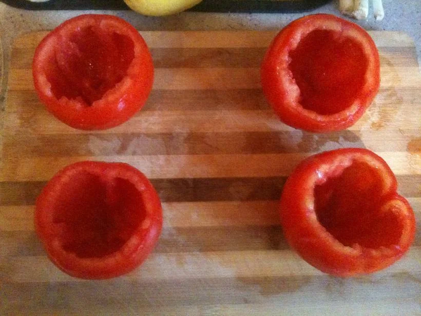 Baked fish with stuffed tomatoes