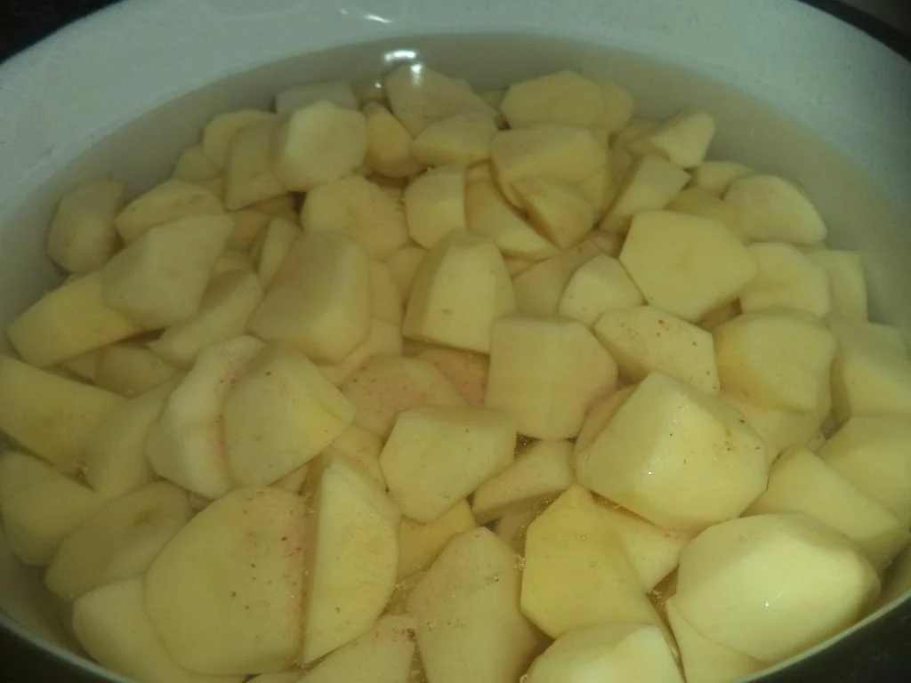 Vegan mashed potatoes with Brussels sprouts in tomato sauce