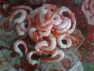 Shrimp sautéed in garlic butter served with baked potatoes