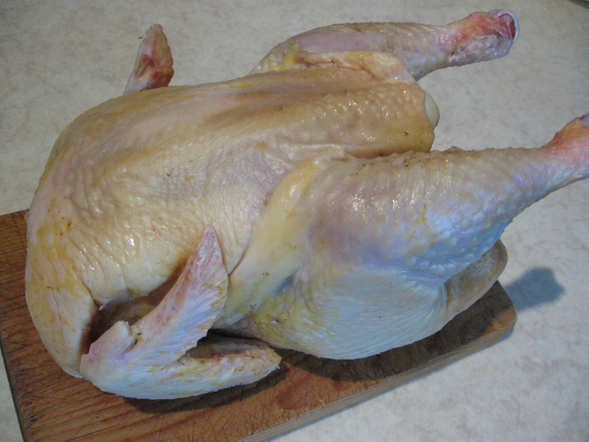 Oven-baked chicken with lemon on a bed of apples and onions