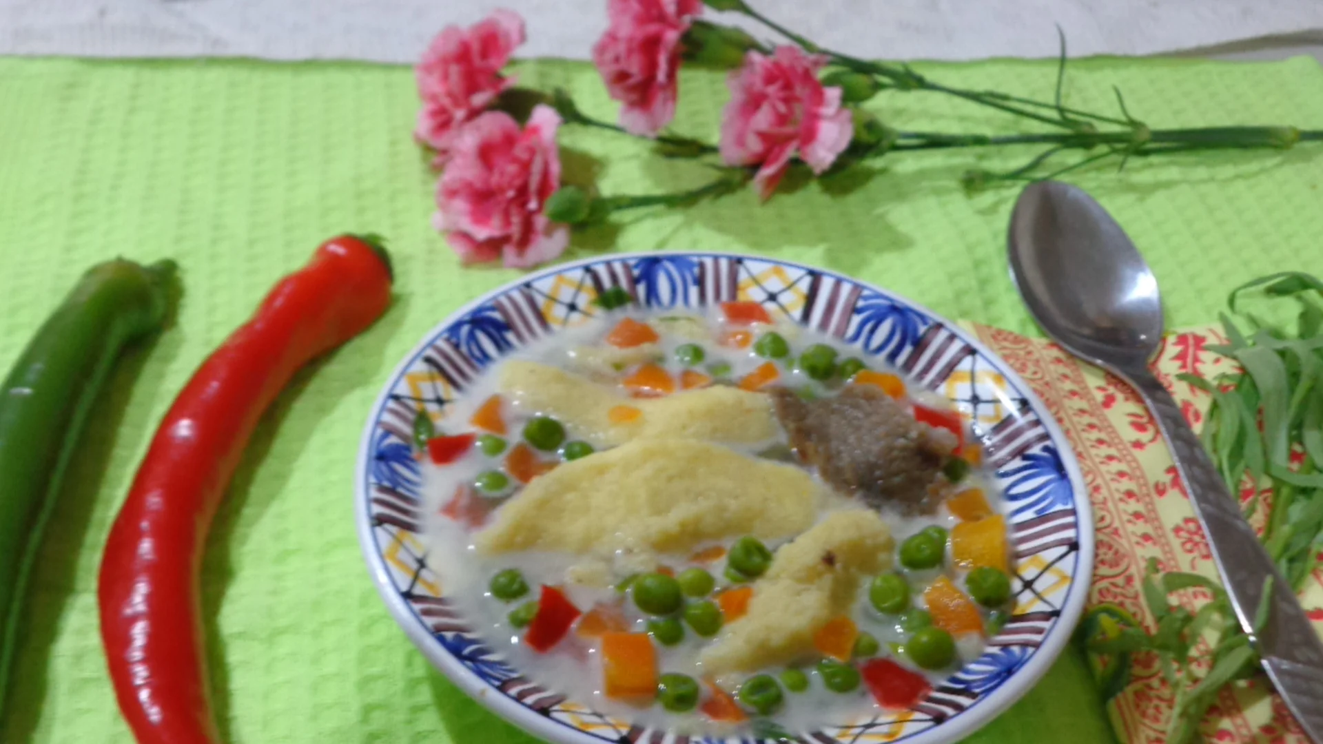 Veal soup with peas, sour cream, and tarragon