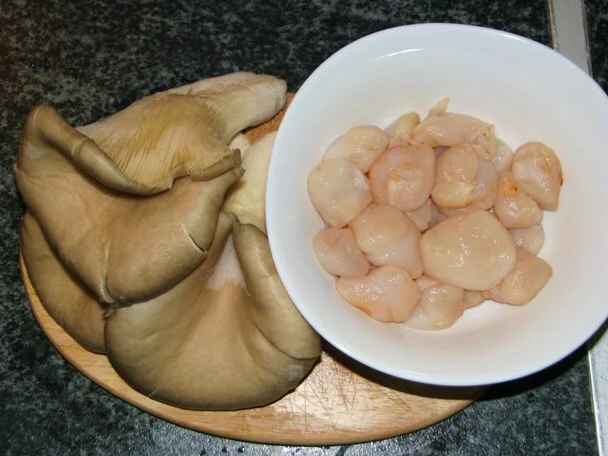 Scallops with mushrooms in reduced fish sauce