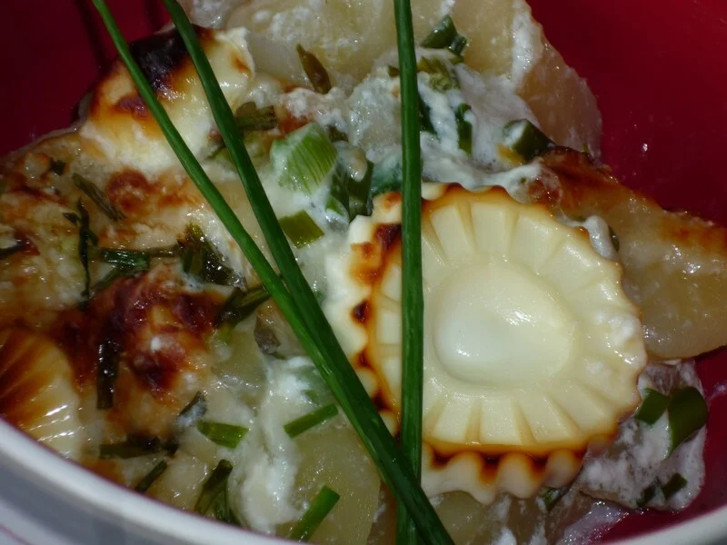 Potatoes with cheese and chives baked