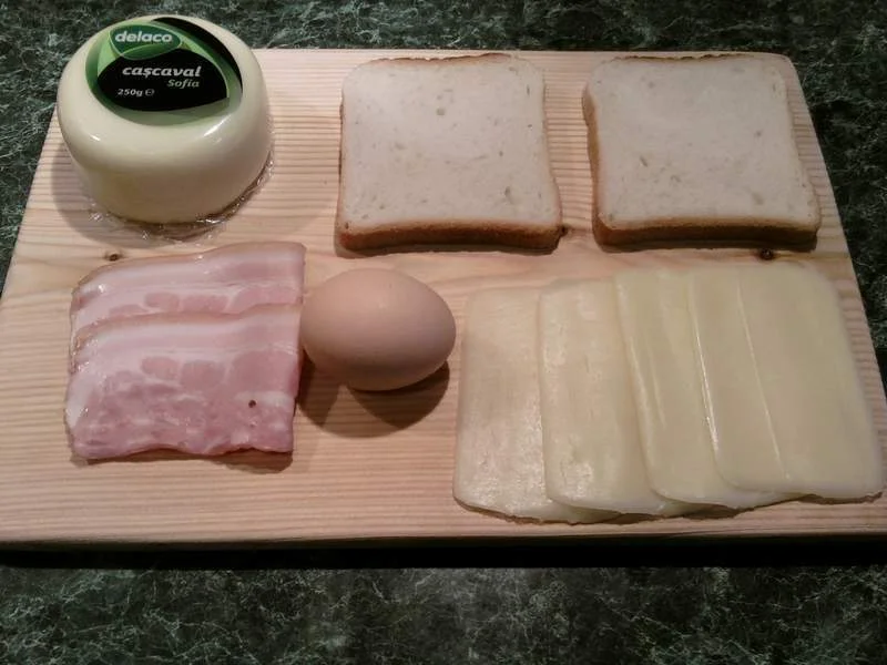 Sandwich with Delaco cheese, bacon, and egg