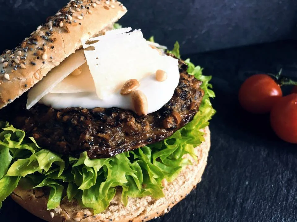 Vegetarian burger with truffle mayonnaise and pine nuts