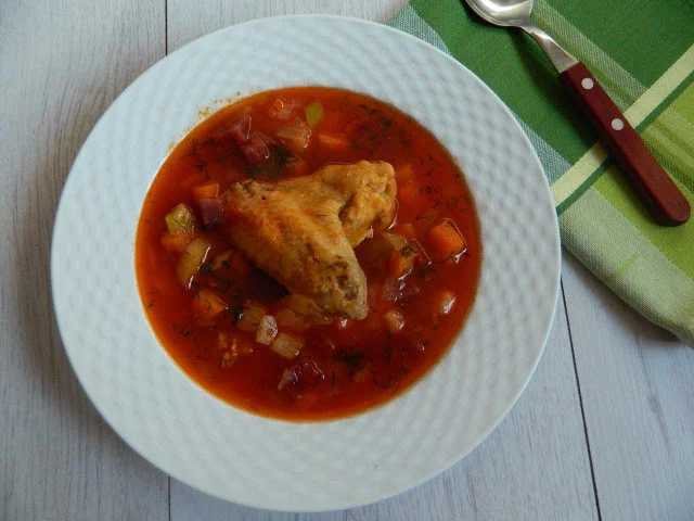 Chicken offal soup with red beet and leek