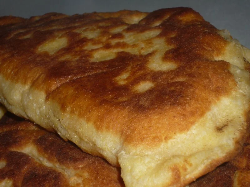 Cornmeal pies with cheese in a skillet